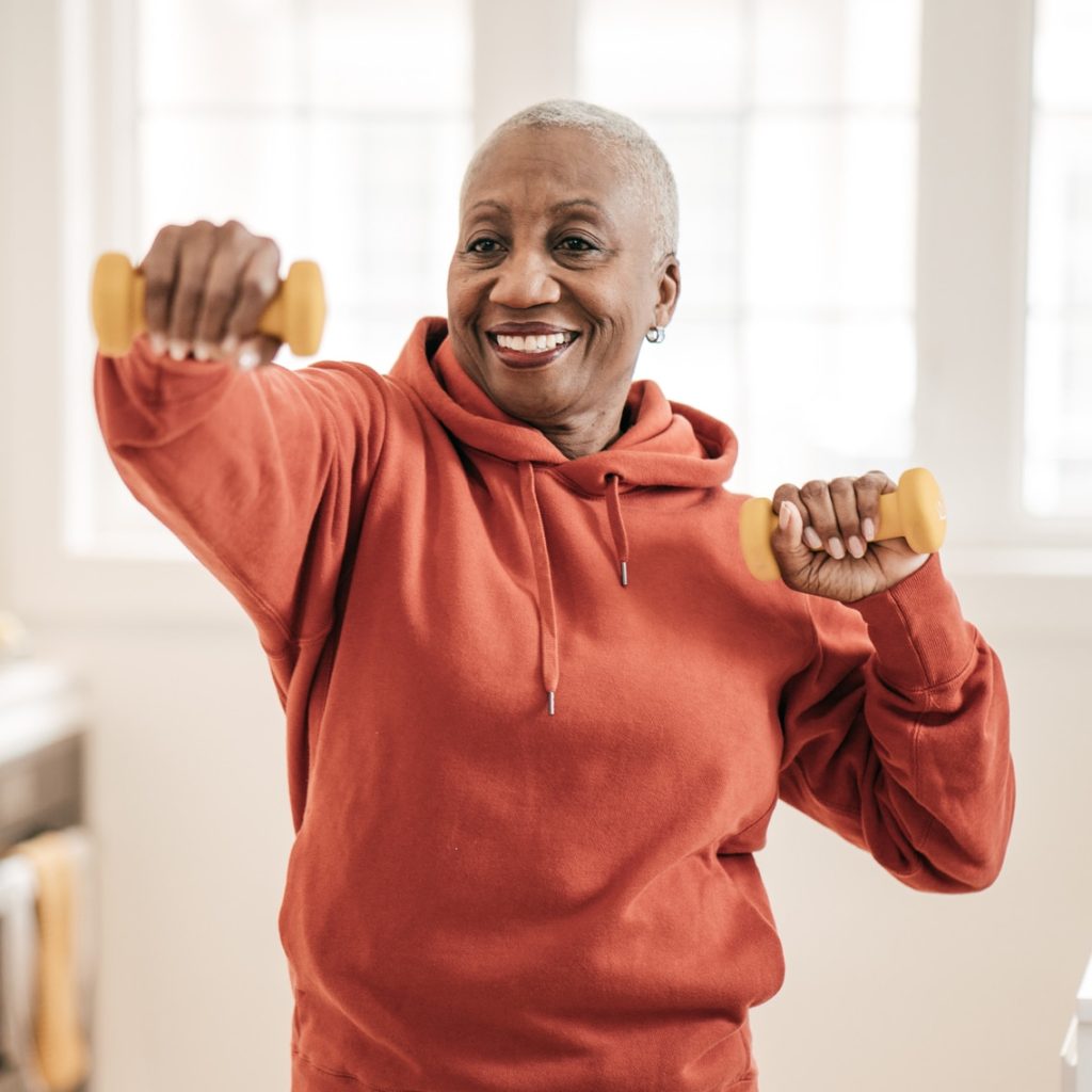 Senior women exercising at home